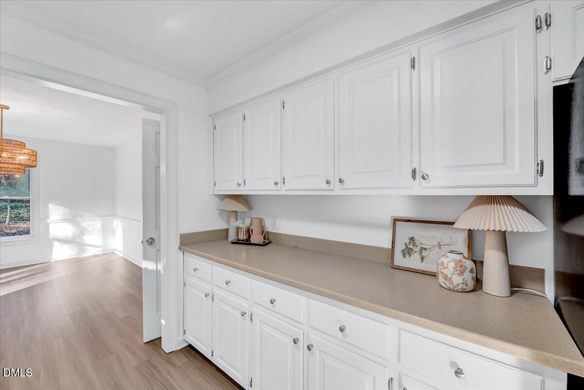 1208 Turner Farms Road Garner, NC 27529 - Photo 16 of 38 a kitchen with granite countertop white cabinets and sink