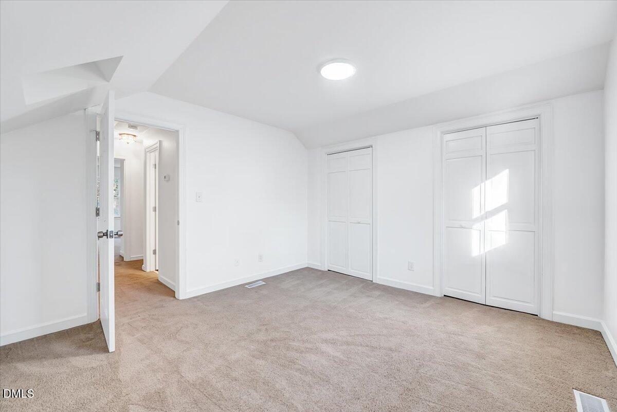 1208 Turner Farms Road Garner, NC 27529 - Photo 27 of 38 an empty room with windows and closet
