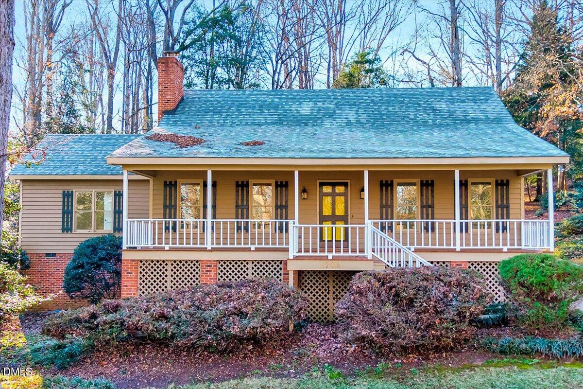 1208 Turner Farms Road Garner, NC 27529 - Photo 2 of 38 a house view with a garden space