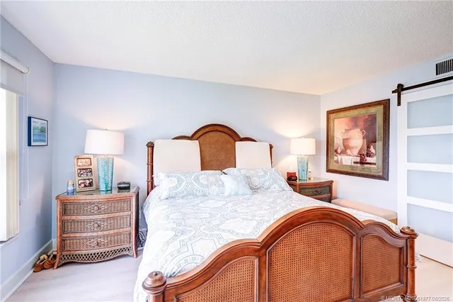 a view of a livingroom with workspace and a couch