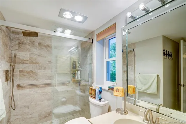 a view of a swimming pool with a yard and plants