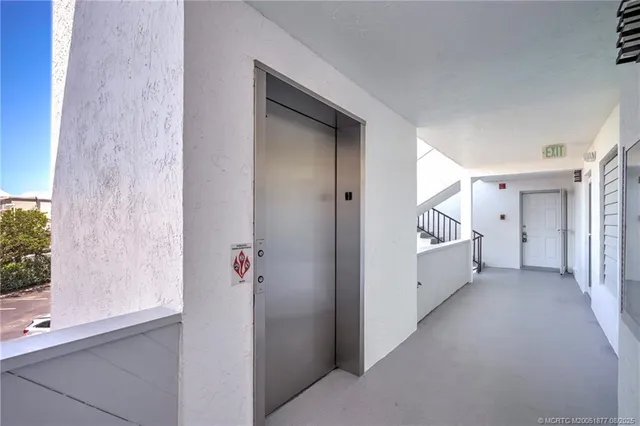a kitchen with a refrigerator a sink and cabinets