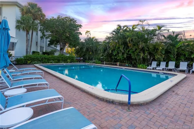 an aerial view of a house with a ocean view