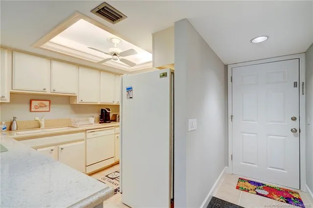 a view of hallway with wooden floor and closet