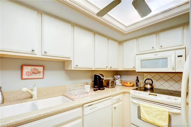 a kitchen with a stove and cabinets