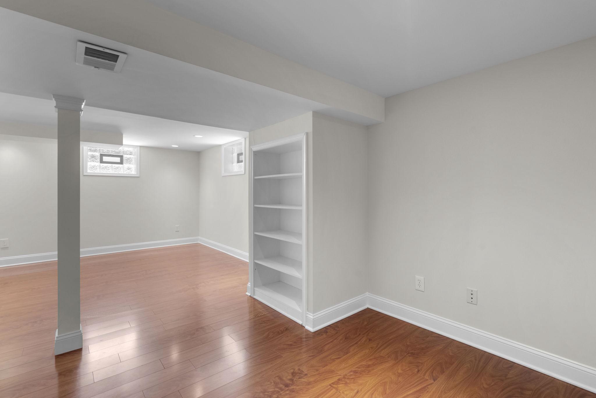 513 Park Road Rockville, MD 20850 - Photo 23 of 43 Built-in Bookshelf in the Basement Rec Room