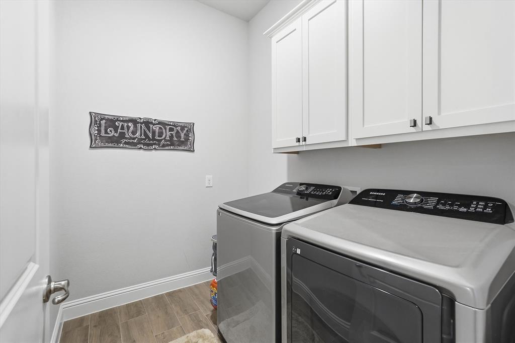 813 Mildren Lane Fate, TX 75087 - Photo 20 of 32 The utility room is amazingly spacious, offers tile flooring, 10' ceiling (like the rest of the home), and space for an extra fridge or freezer! The washer and dryer set convey with the sale of the home as well!