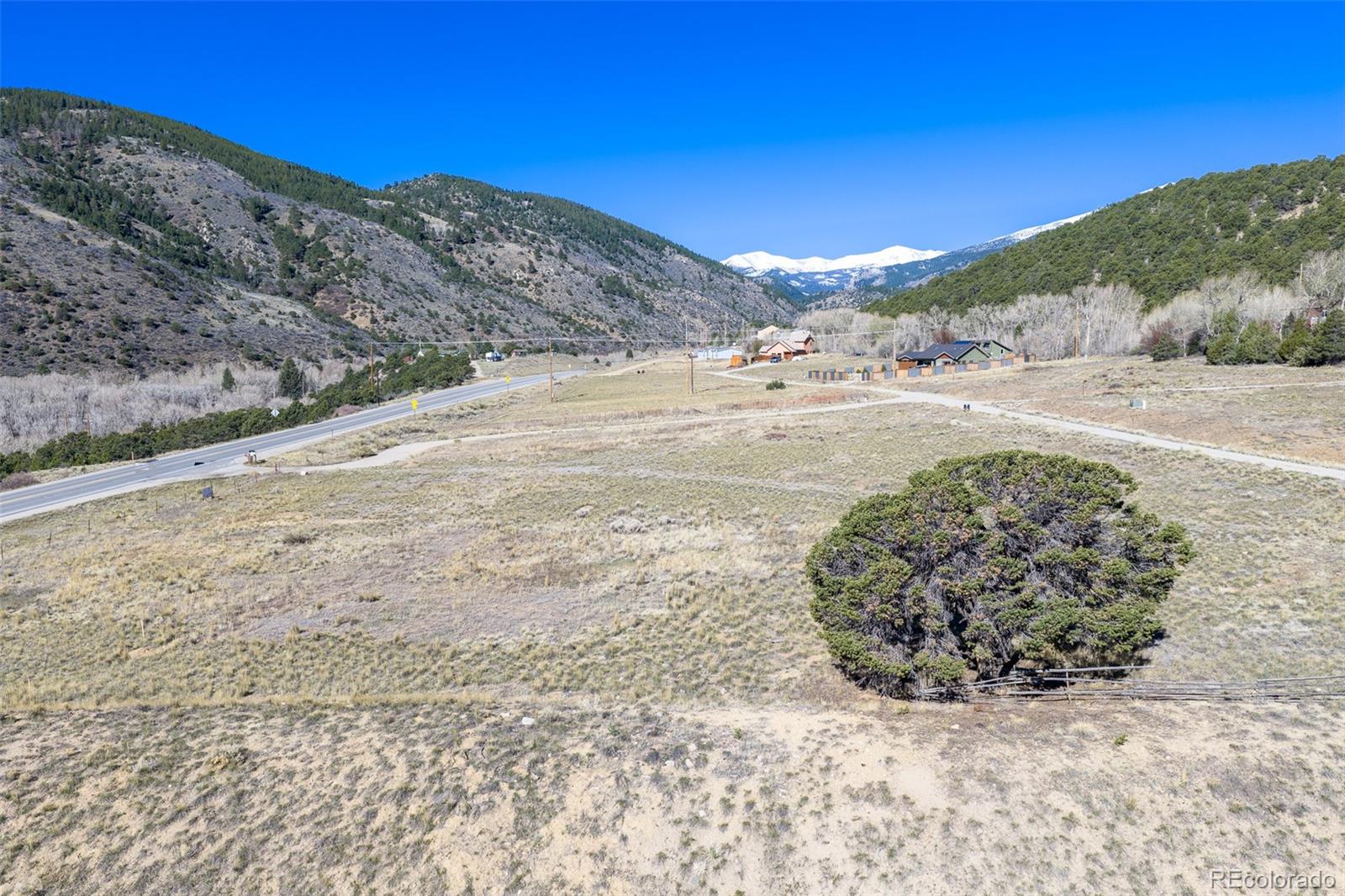 16509 Rocky Mountain Road Salida, CO 81201 - Photo 12 of 12 a view of a dry yard with mountains in the background