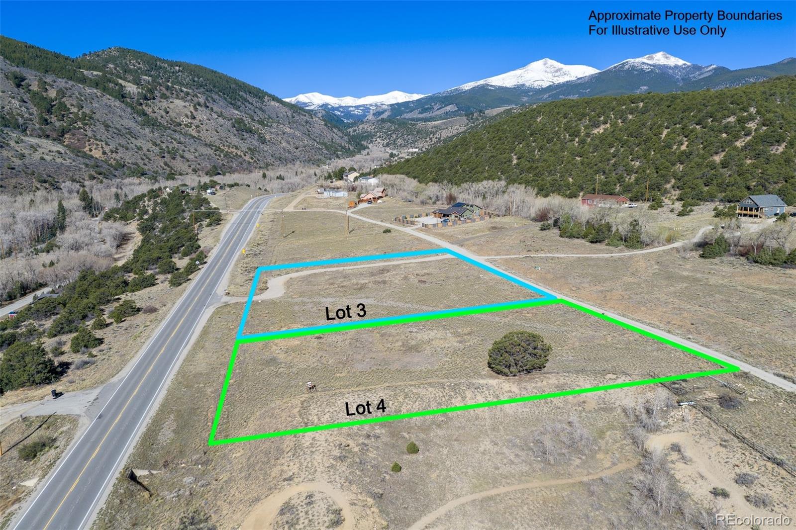16509 Rocky Mountain Road Salida, CO 81201 - Photo 3 of 12 a green field with mountains in the background