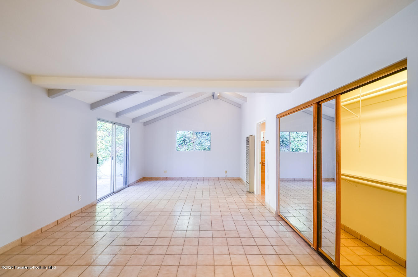 588 Glen Holly Drive Pasadena, CA 91105 - Photo 14 of 31 wooden floor in an empty room with a window