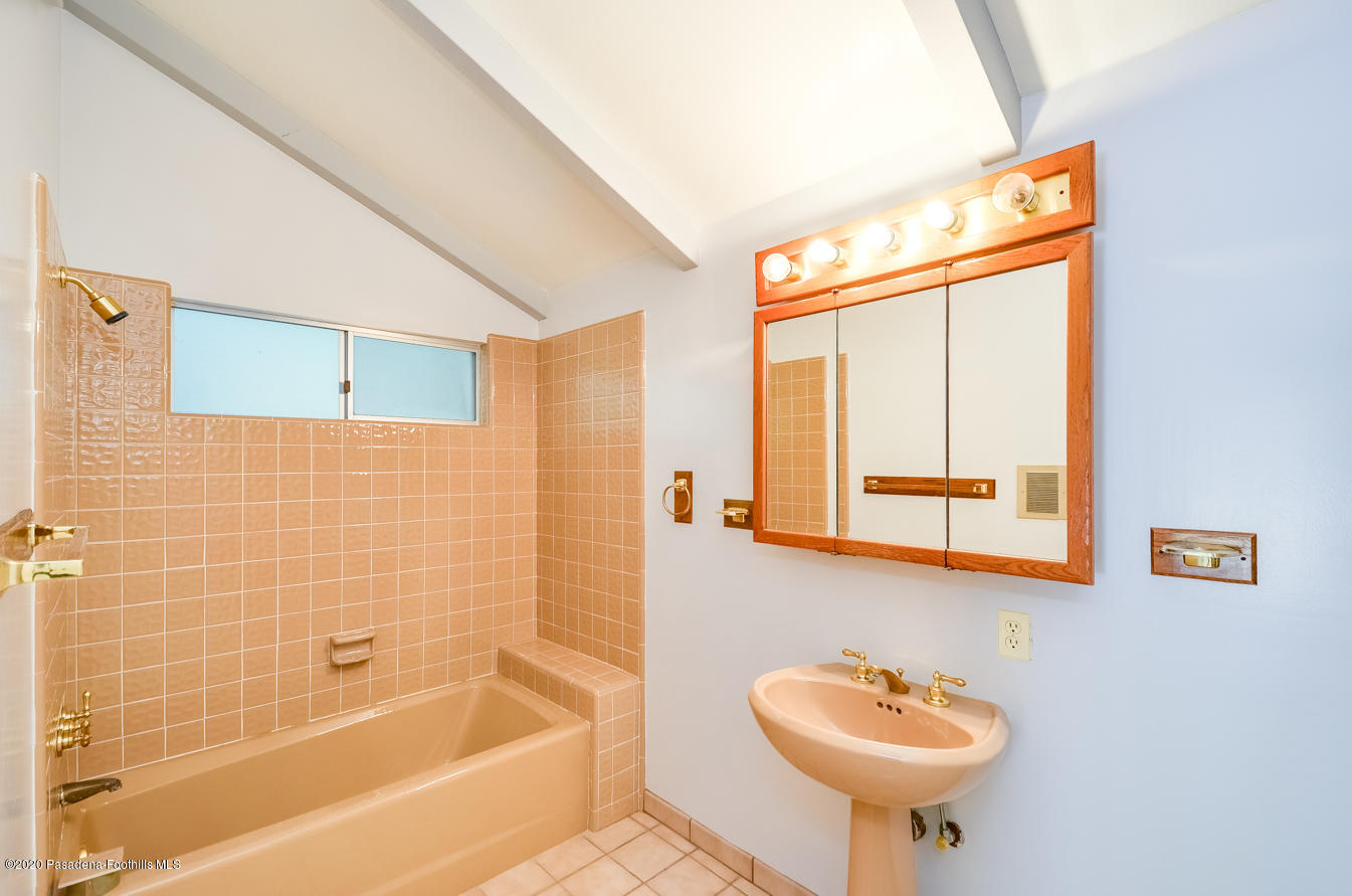 588 Glen Holly Drive Pasadena, CA 91105 - Photo 16 of 31 a bathroom with a sink and a bathtub