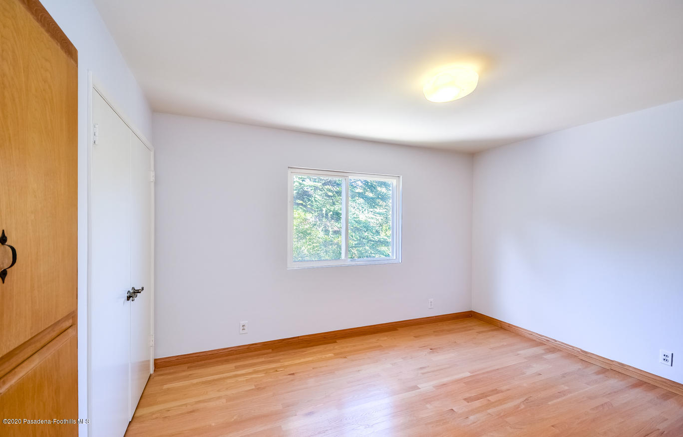 588 Glen Holly Drive Pasadena, CA 91105 - Photo 17 of 31 a view of empty room with window