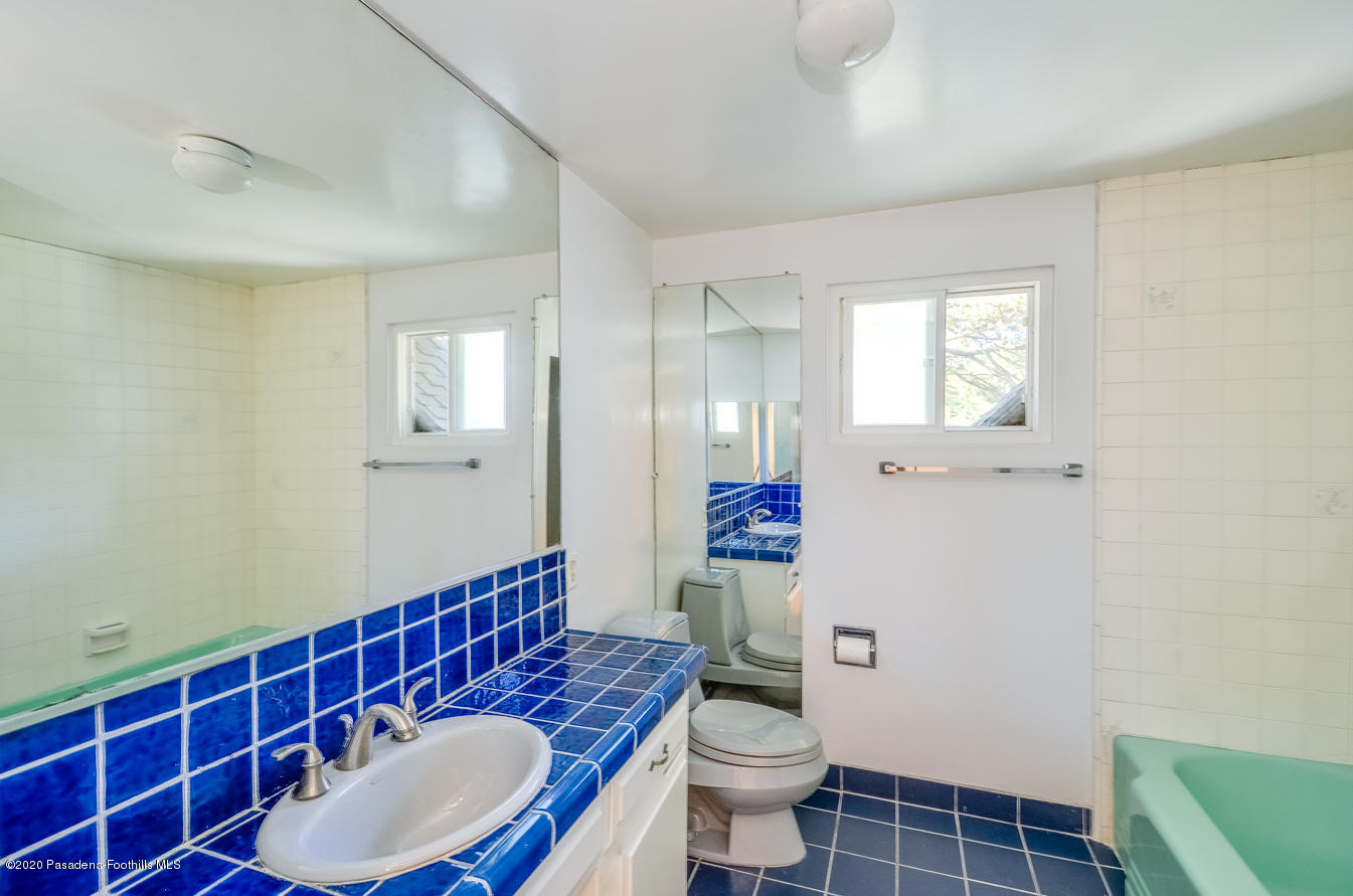 588 Glen Holly Drive Pasadena, CA 91105 - Photo 24 of 31 a bathroom with a sink a toilet and shower