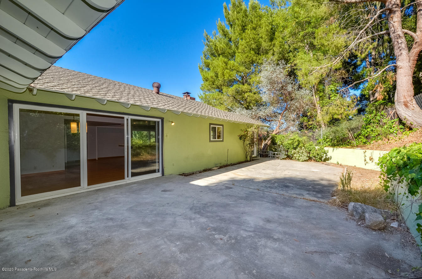 588 Glen Holly Drive Pasadena, CA 91105 - Photo 28 of 31 a view of a house with a backyard