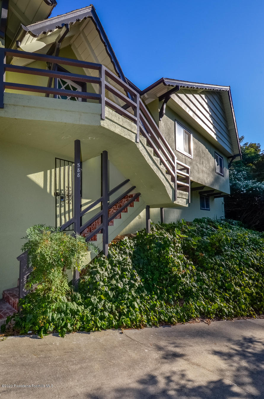 588 Glen Holly Drive Pasadena, CA 91105 - Photo 30 of 31 a front view of a house with a garden
