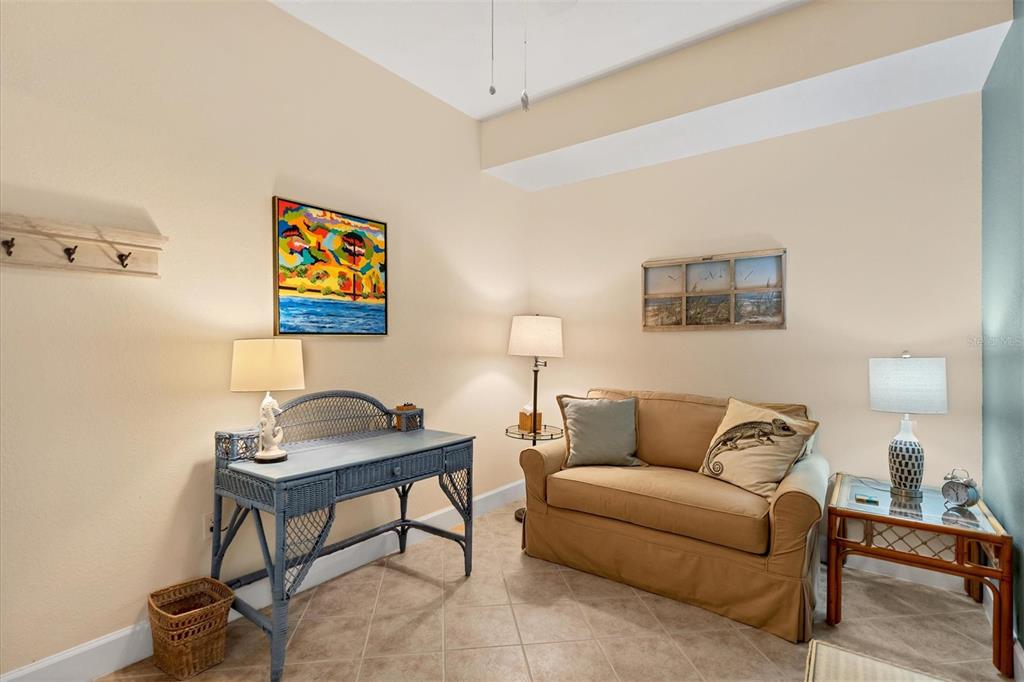 13313 Gasparilla Road, Unit 204 Placida, FL 33946 - Photo 13 of 28 a living room with furniture and a lamp