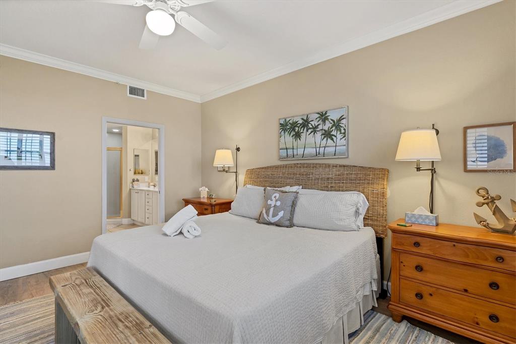 13313 Gasparilla Road, Unit 204 Placida, FL 33946 - Photo 14 of 28 a bedroom with a bed and a dresser