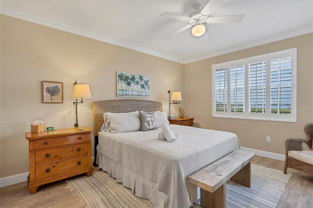 13313 Gasparilla Road, Unit 204 Placida, FL 33946 - Photo 15 of 28 a bedroom with a bed and a window