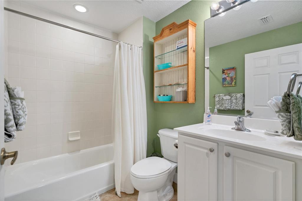 13313 Gasparilla Road, Unit 204 Placida, FL 33946 - Photo 21 of 28 a bathroom with a sink toilet and shower