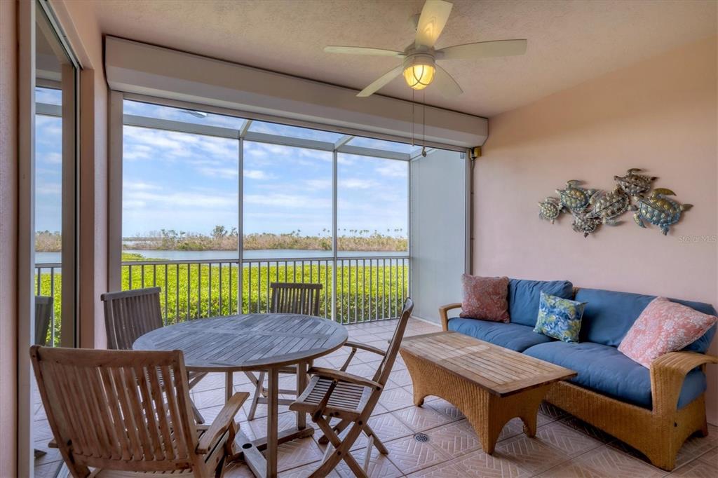 13313 Gasparilla Road, Unit 204 Placida, FL 33946 - Photo 23 of 28 a view of a dining room with furniture window and outside view