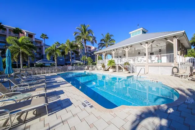 a view of a swimming pool with sitting area