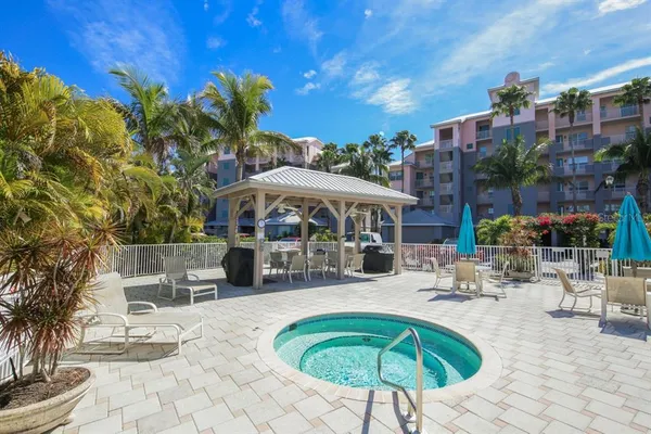 a swimming pool with outdoor seating and yard