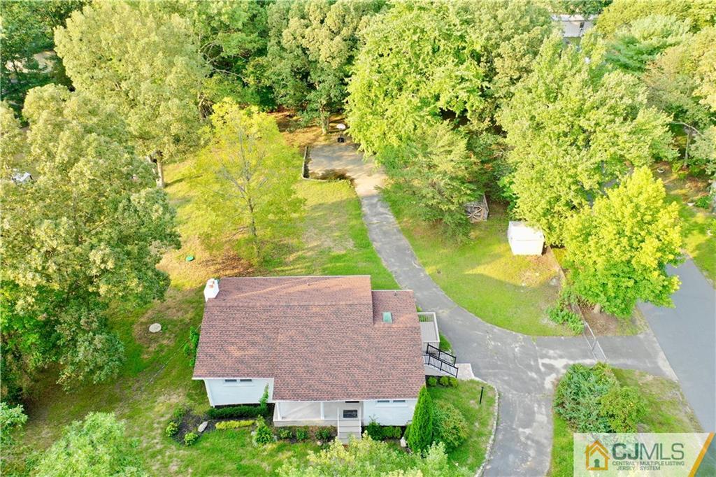 236 Spring Valley Road Morganville, NJ 07751 - Photo 22 of 23 an aerial view of a house with swimming pool and garden