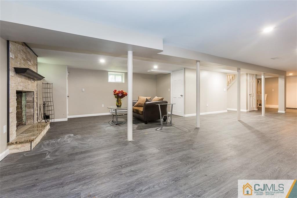 236 Spring Valley Road Morganville, NJ 07751 - Photo 10 of 23 a view of a livingroom with furniture and an empty room