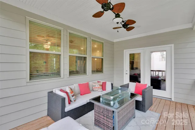 a living room with furniture pool table and flat screen tv