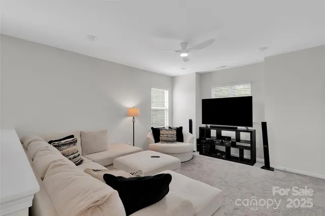 a living room with furniture and a lamp