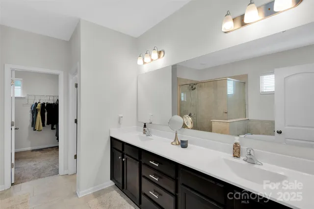 a bathroom with a bathtub and mirror