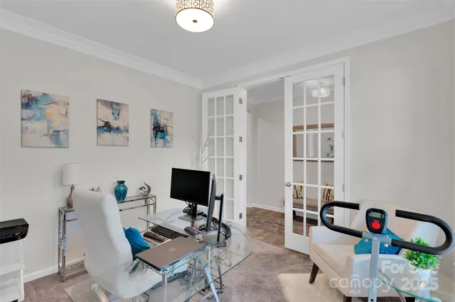a living room with furniture and stairs