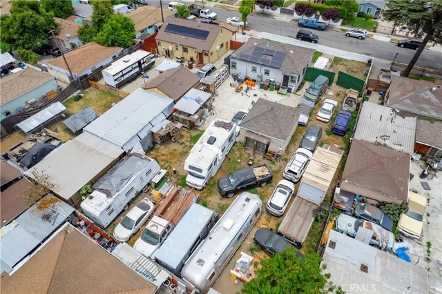 an aerial view of a residential houses with outdoor space