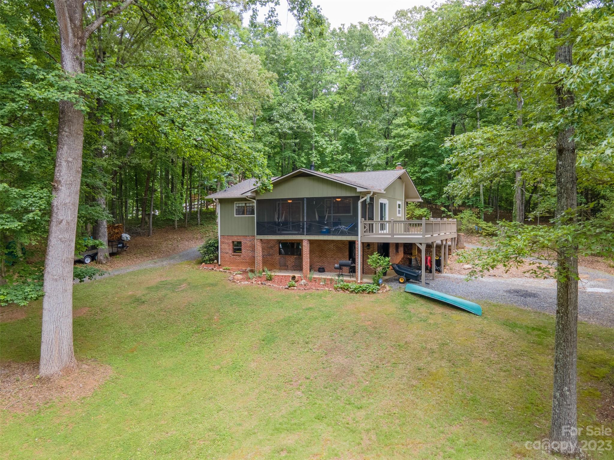 a view of a house with backyard porch and sitting area
