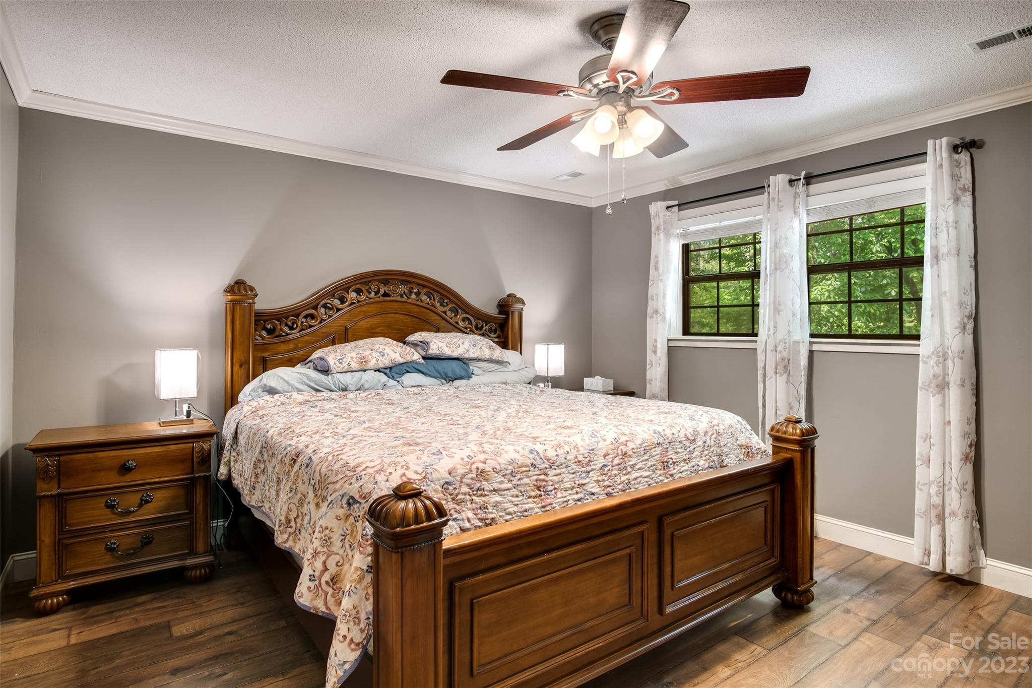 669 Walker Point Road Hayesville, NC 28904 - Photo 15 of 46 a bedroom with a bed and a tv on the dresser