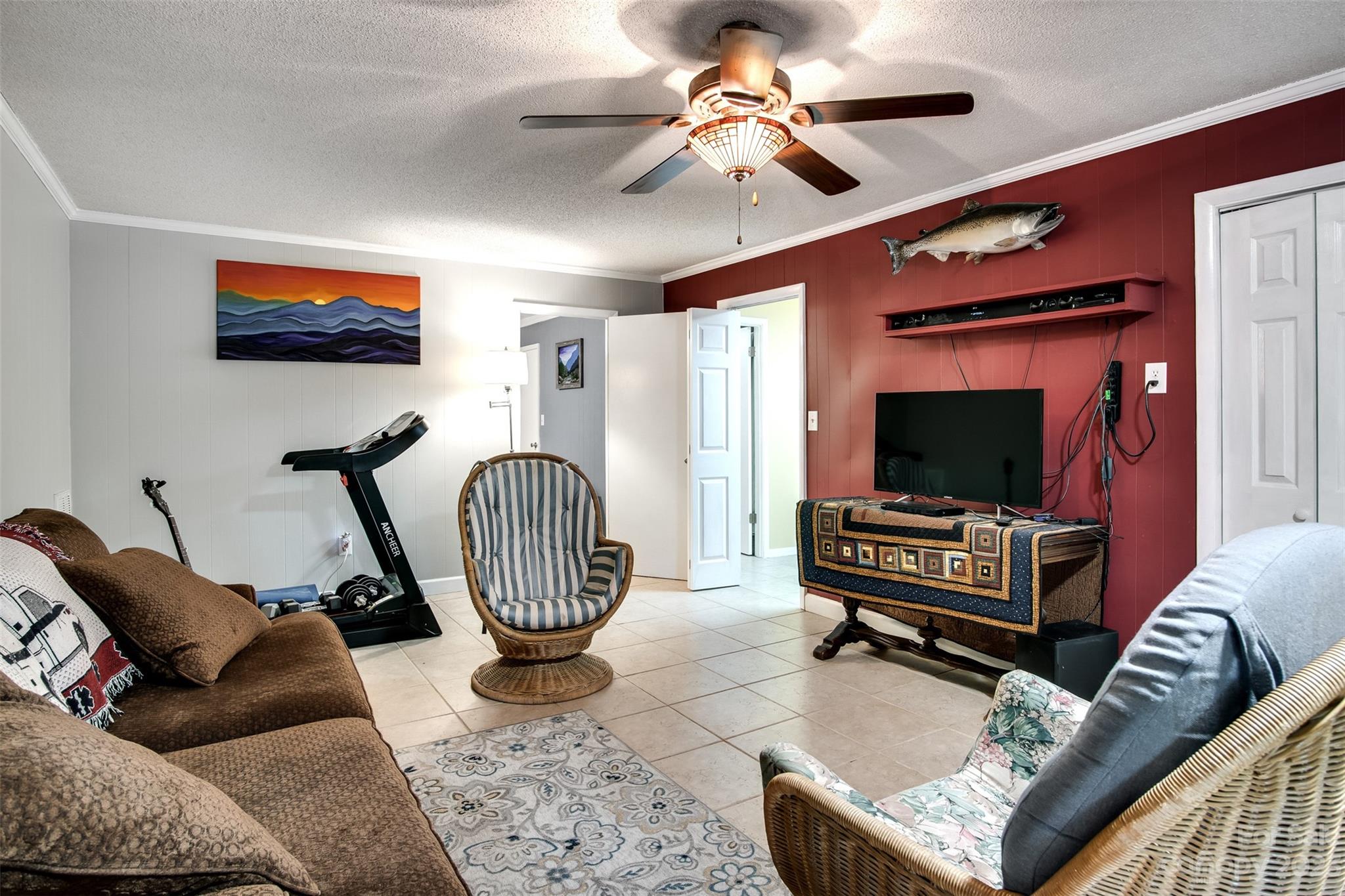 669 Walker Point Road Hayesville, NC 28904 - Photo 20 of 46 a living room with furniture a flat screen tv and a window