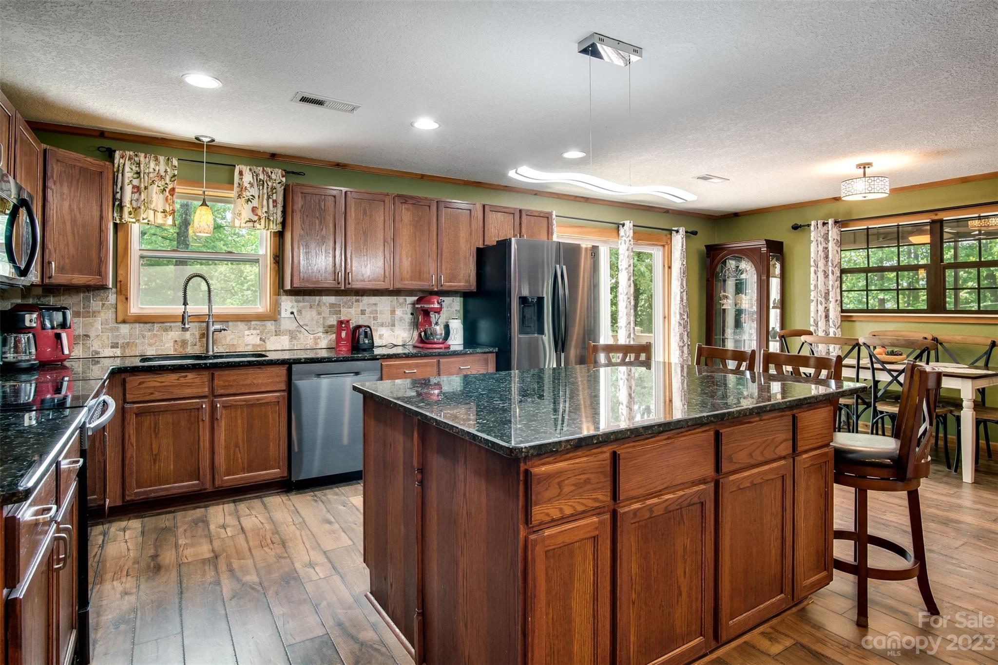 669 Walker Point Road Hayesville, NC 28904 - Photo 2 of 46 a kitchen with lots of counter top space and center island