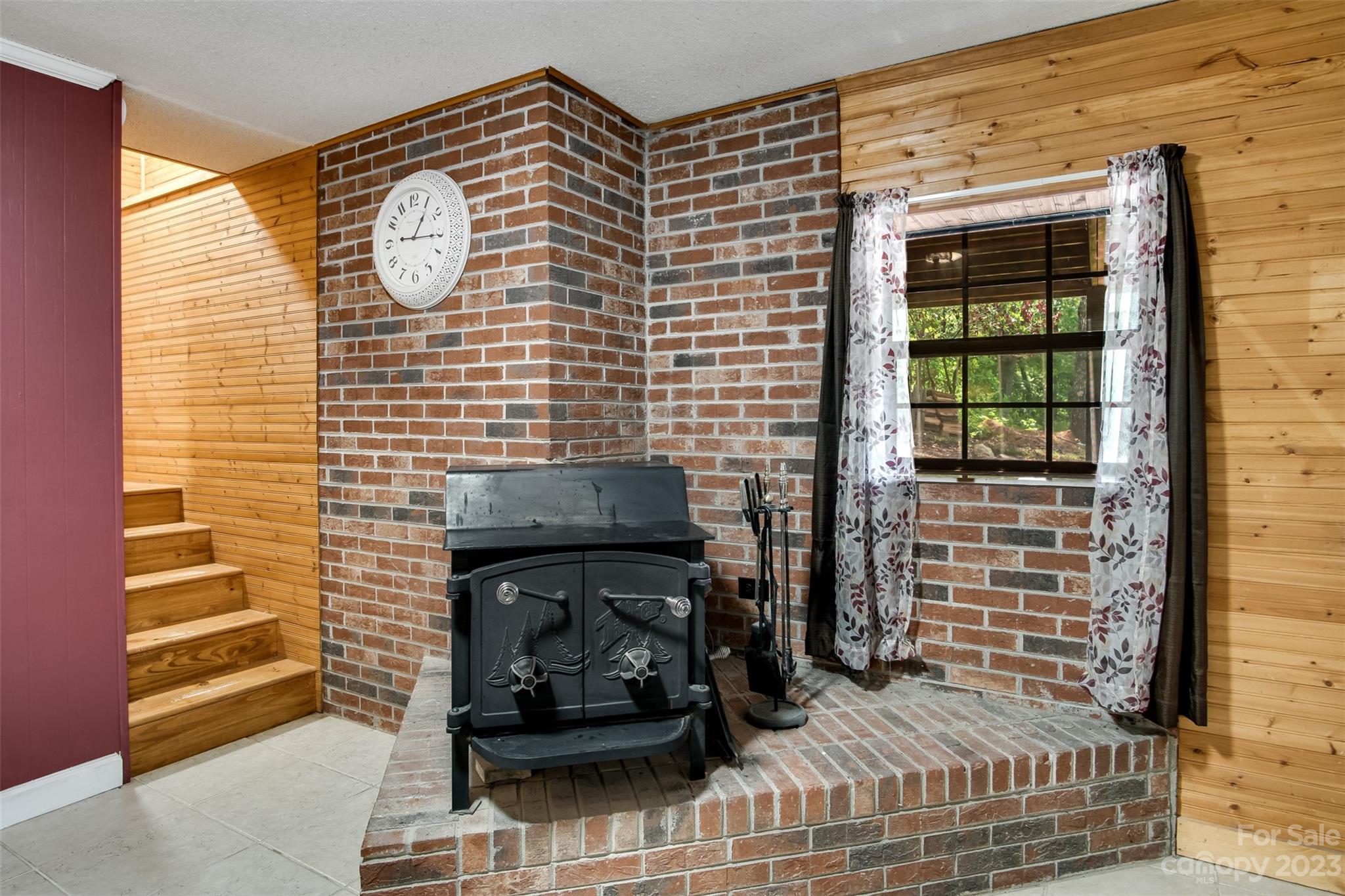 669 Walker Point Road Hayesville, NC 28904 - Photo 21 of 46 a view of a fireplace with wooden floor