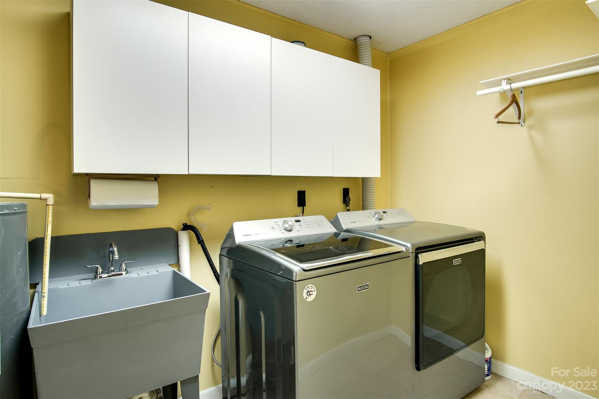 669 Walker Point Road Hayesville, NC 28904 - Photo 26 of 46 a utility room with sink dryer and washer
