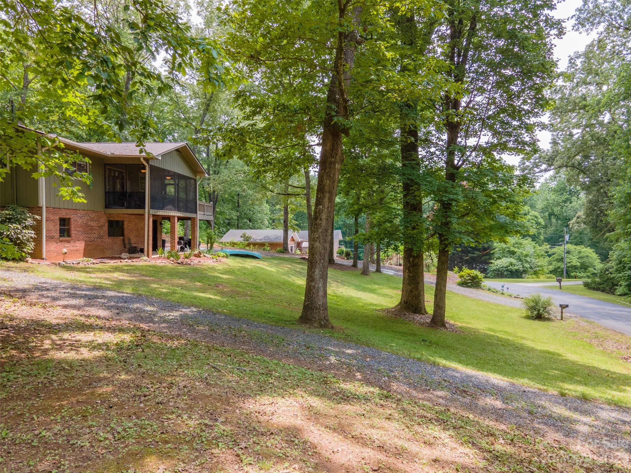 669 Walker Point Road Hayesville, NC 28904 - Photo 35 of 46 a view of a yard with palm tree