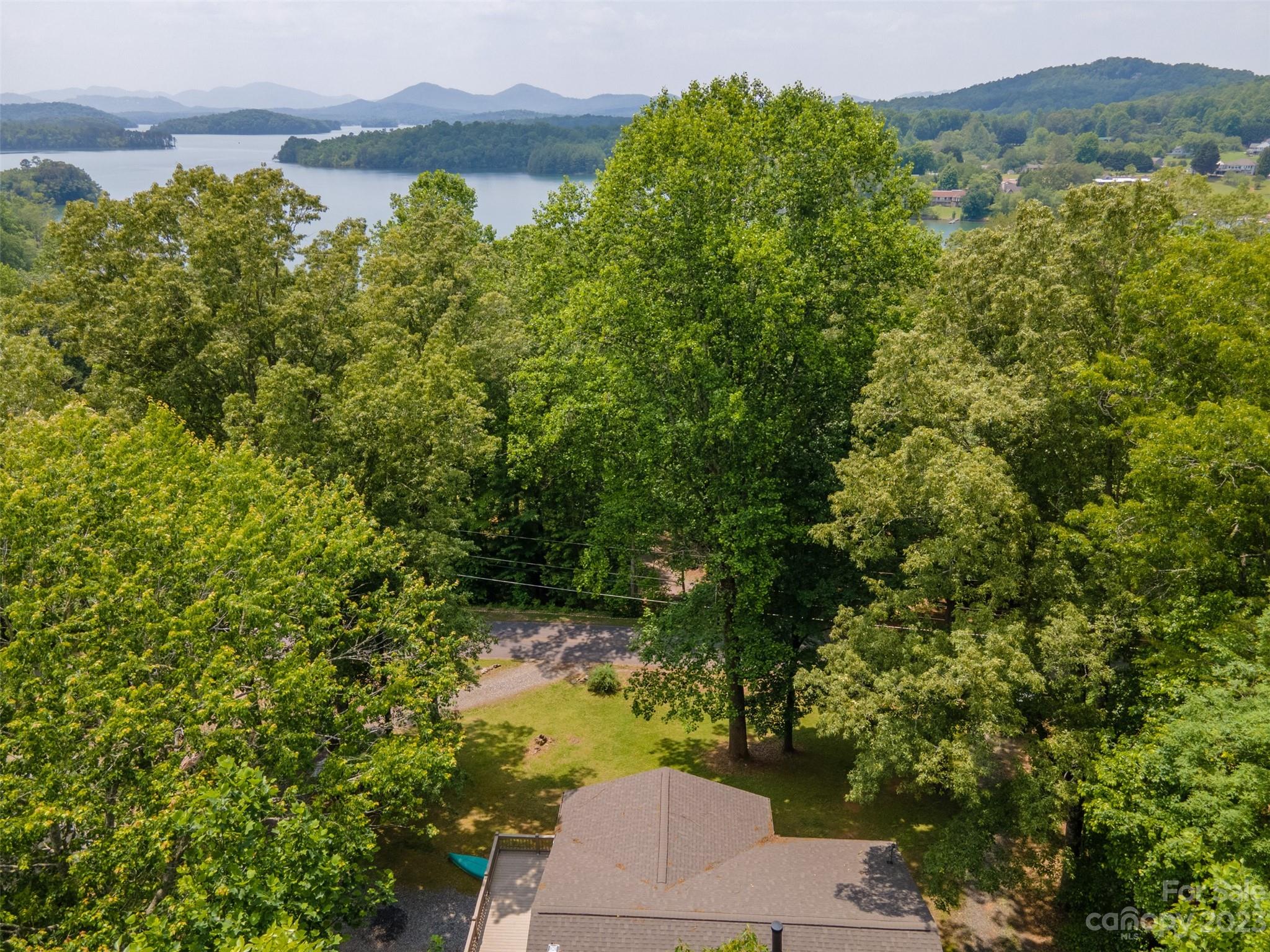 669 Walker Point Road Hayesville, NC 28904 - Photo 43 of 46 an aerial view of a house with a yard