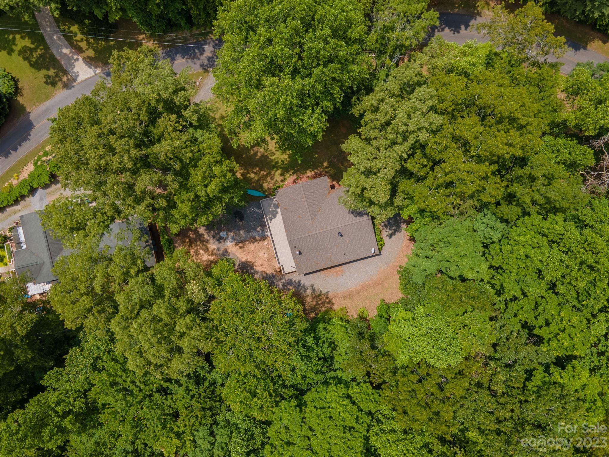669 Walker Point Road Hayesville, NC 28904 - Photo 45 of 46 an aerial view of a house with a yard and lake view