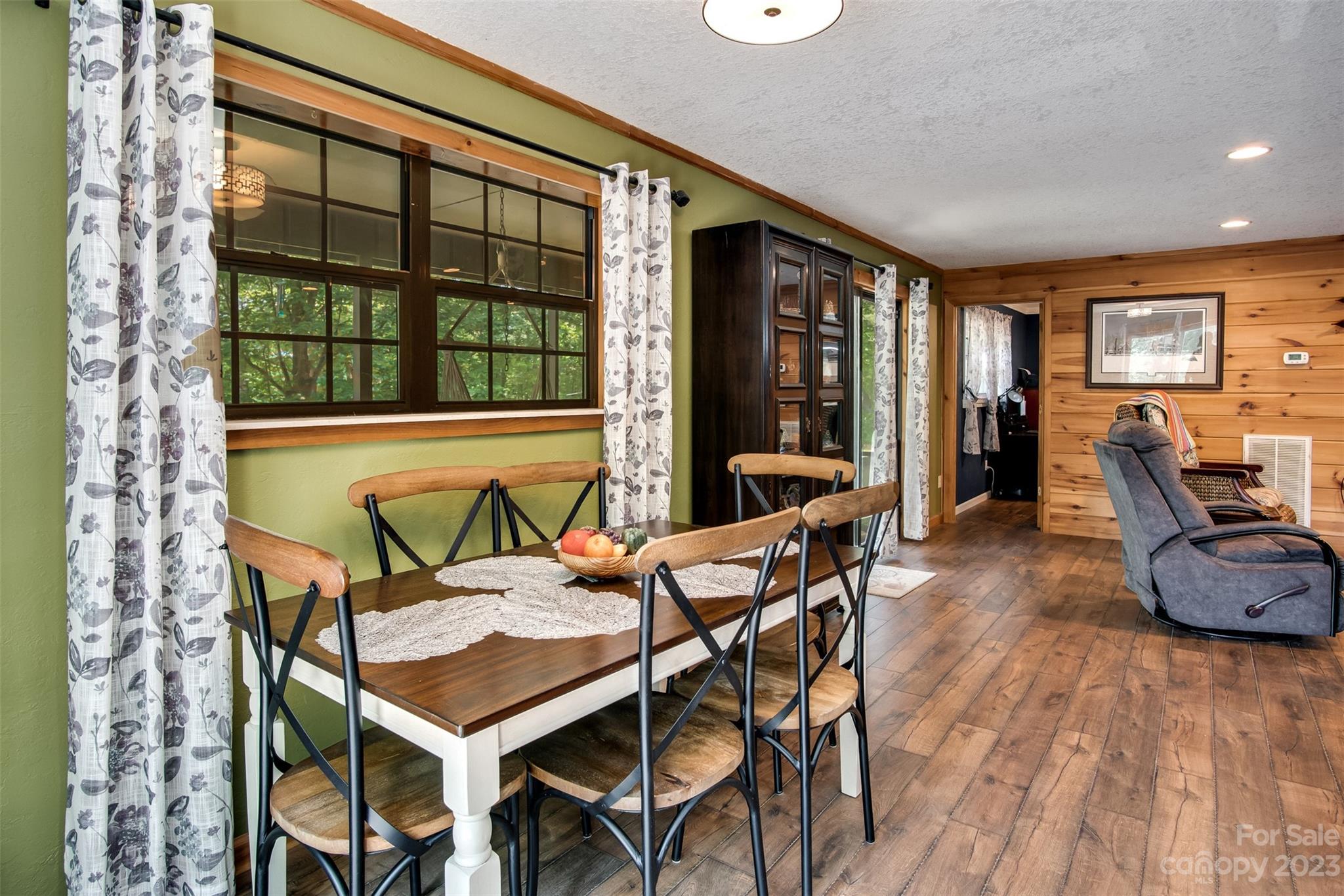 669 Walker Point Road Hayesville, NC 28904 - Photo 5 of 46 a view of a dining room with furniture window and outside view