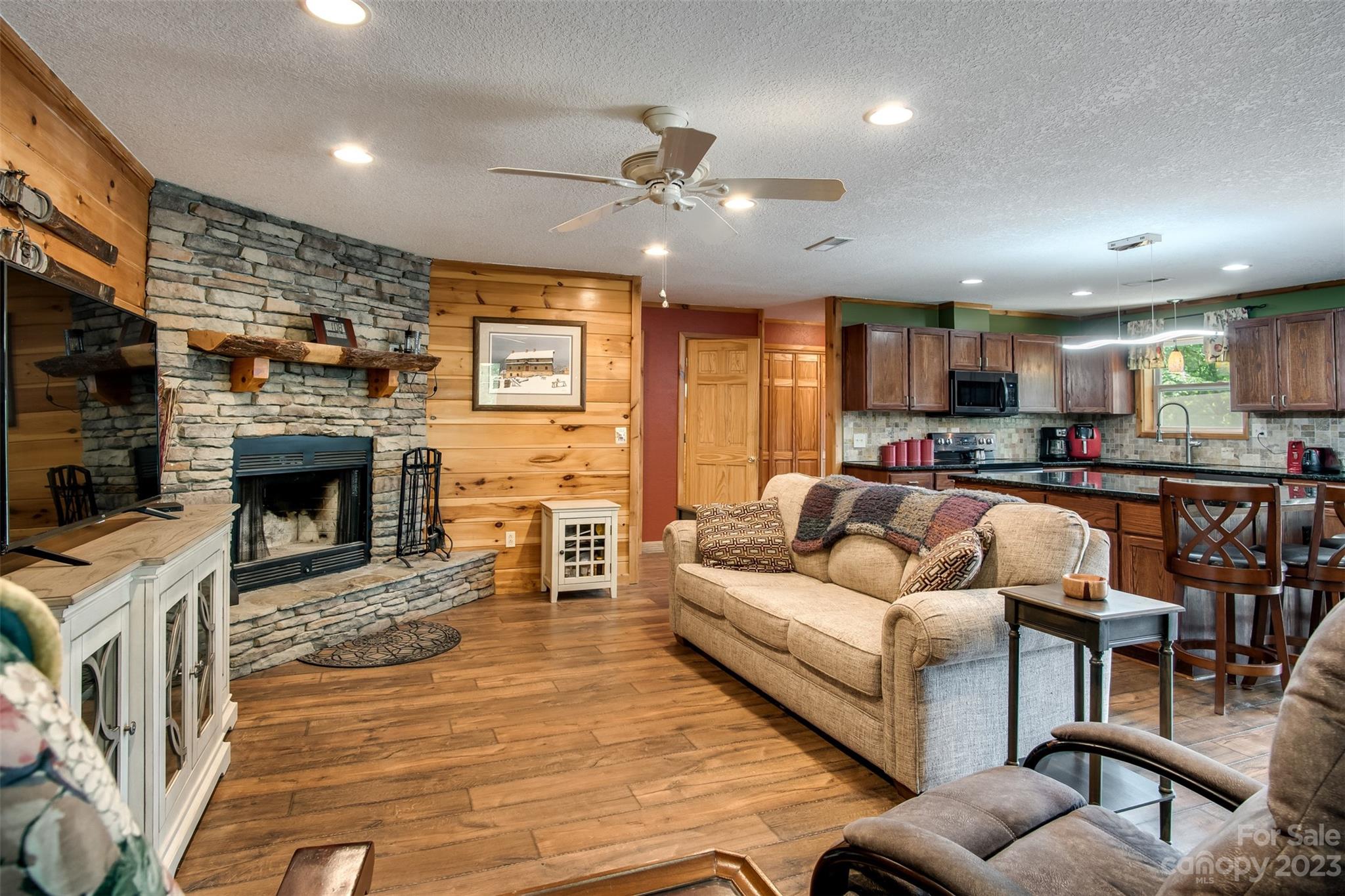669 Walker Point Road Hayesville, NC 28904 - Photo 8 of 46 a living room with furniture and a fireplace