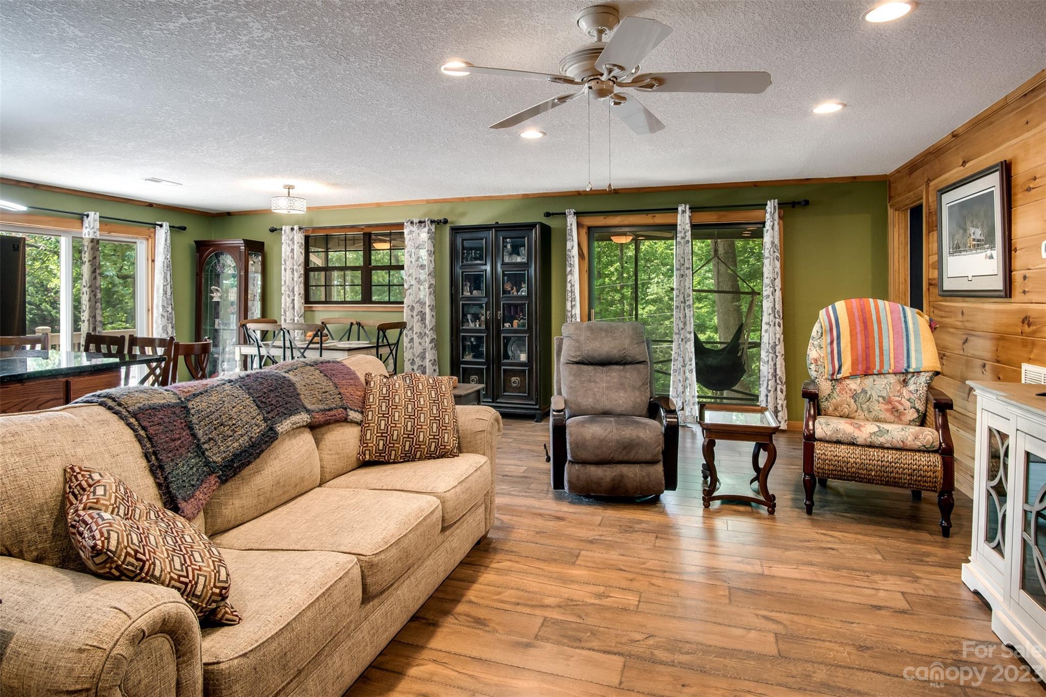 669 Walker Point Road Hayesville, NC 28904 - Photo 10 of 46 a living room with furniture and a large window
