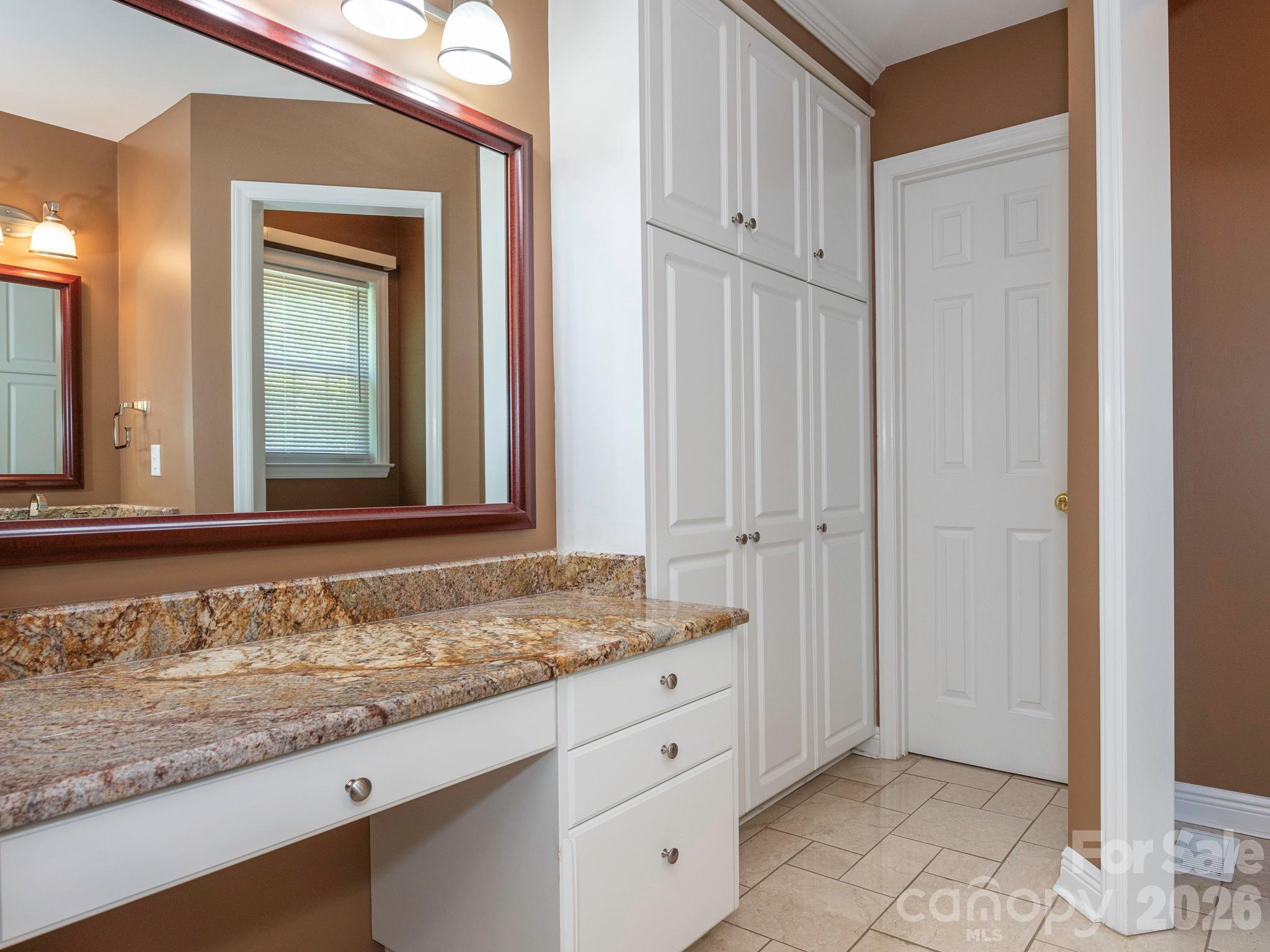 4440 Hucks Road Charlotte, NC 28269 - Photo 23 of 45 a bathroom with a granite countertop sink and a mirror