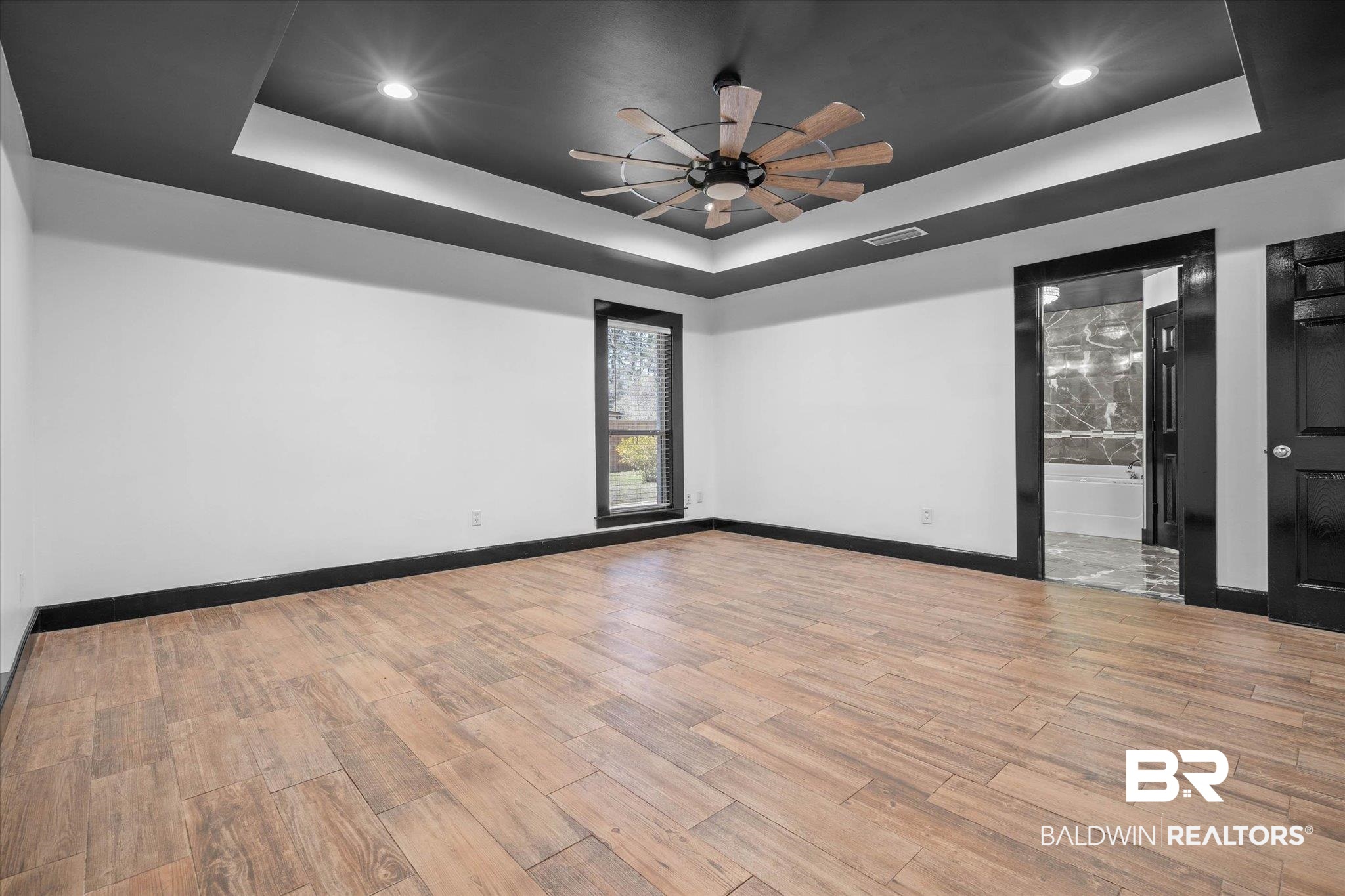 3216 Bay Booster Club Road Theodore, AL 36582 - Photo 10 of 46 Spare room with a raised ceiling, light wood finished floors, ceiling fan, and recessed lighting