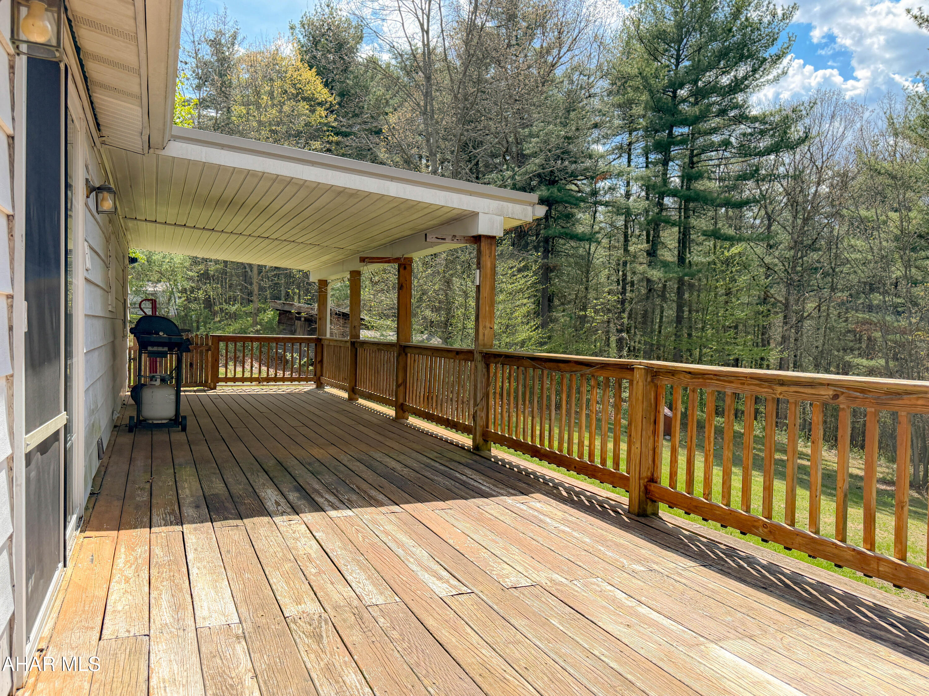 151 Pine Echo Road Everett, PA 15537 - Photo 7 of 51 a view of backyard with a deck and wooden floor