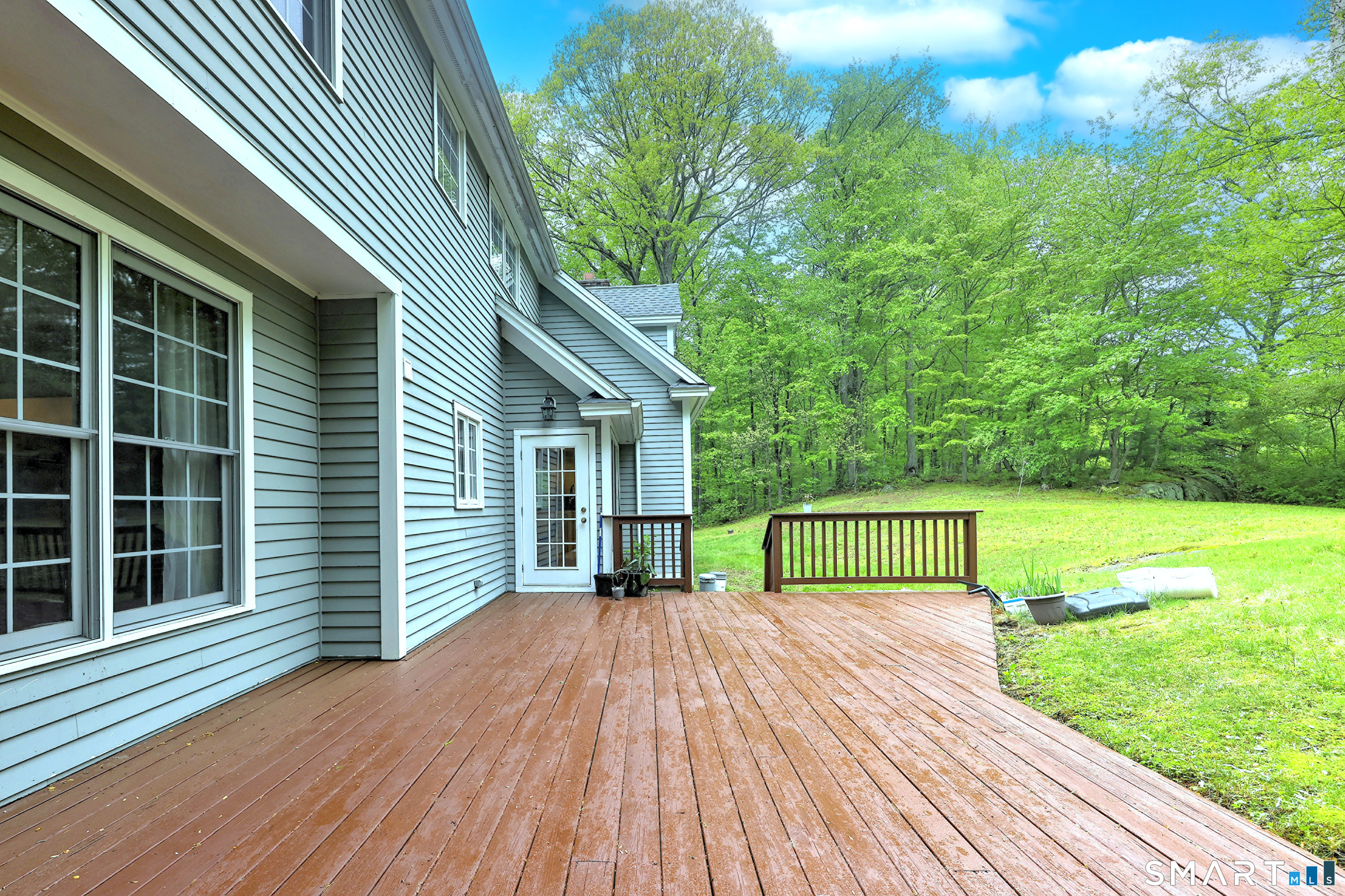 125 Peck Hill Road Woodbridge, CT 06525 - Photo 37 of 40 a view of house with backyard outdoor seating and green space