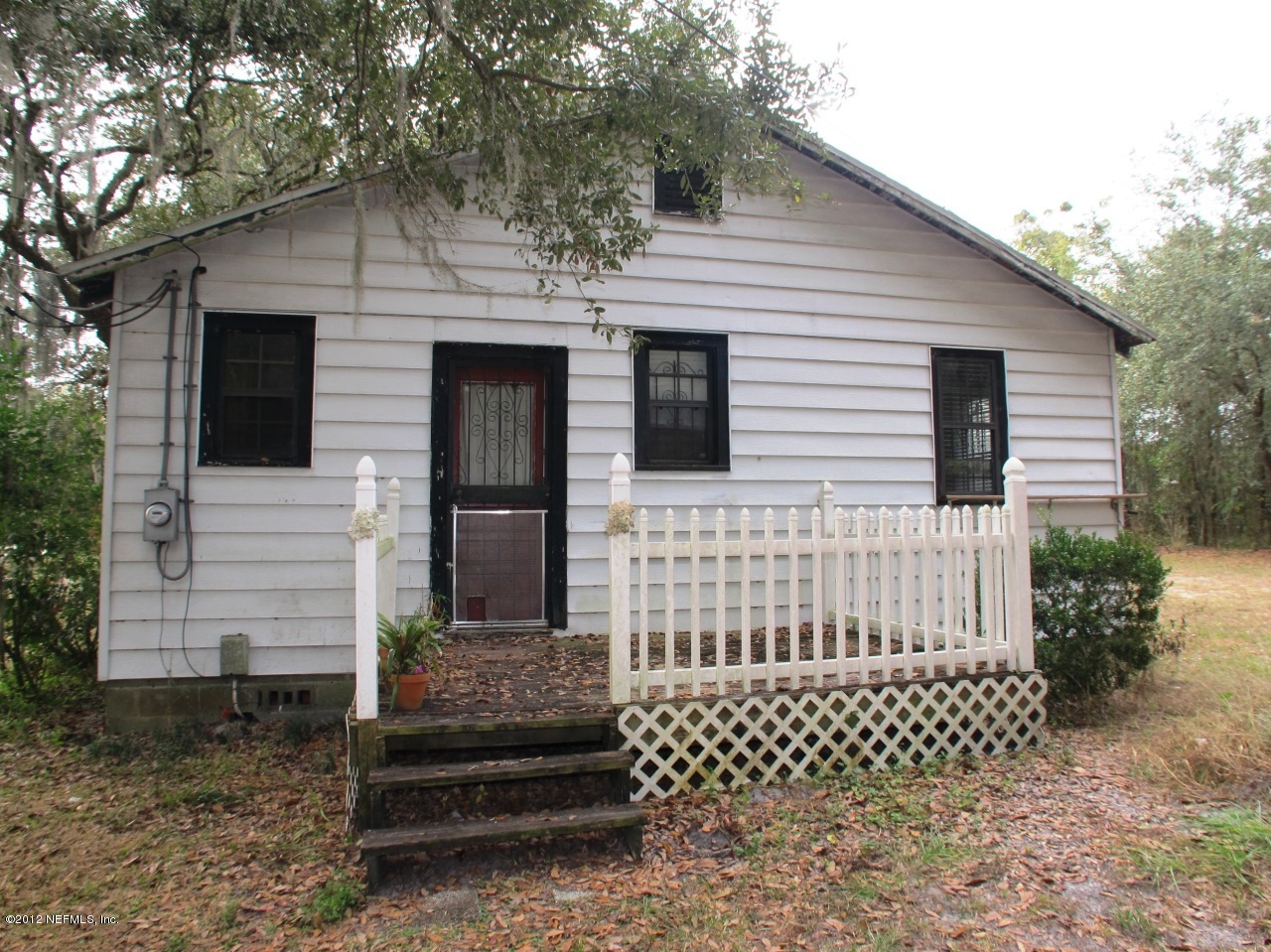 6692 Firestone Road Jacksonville, FL 32244 - Photo 7 of 17 a front view of a house with a garden